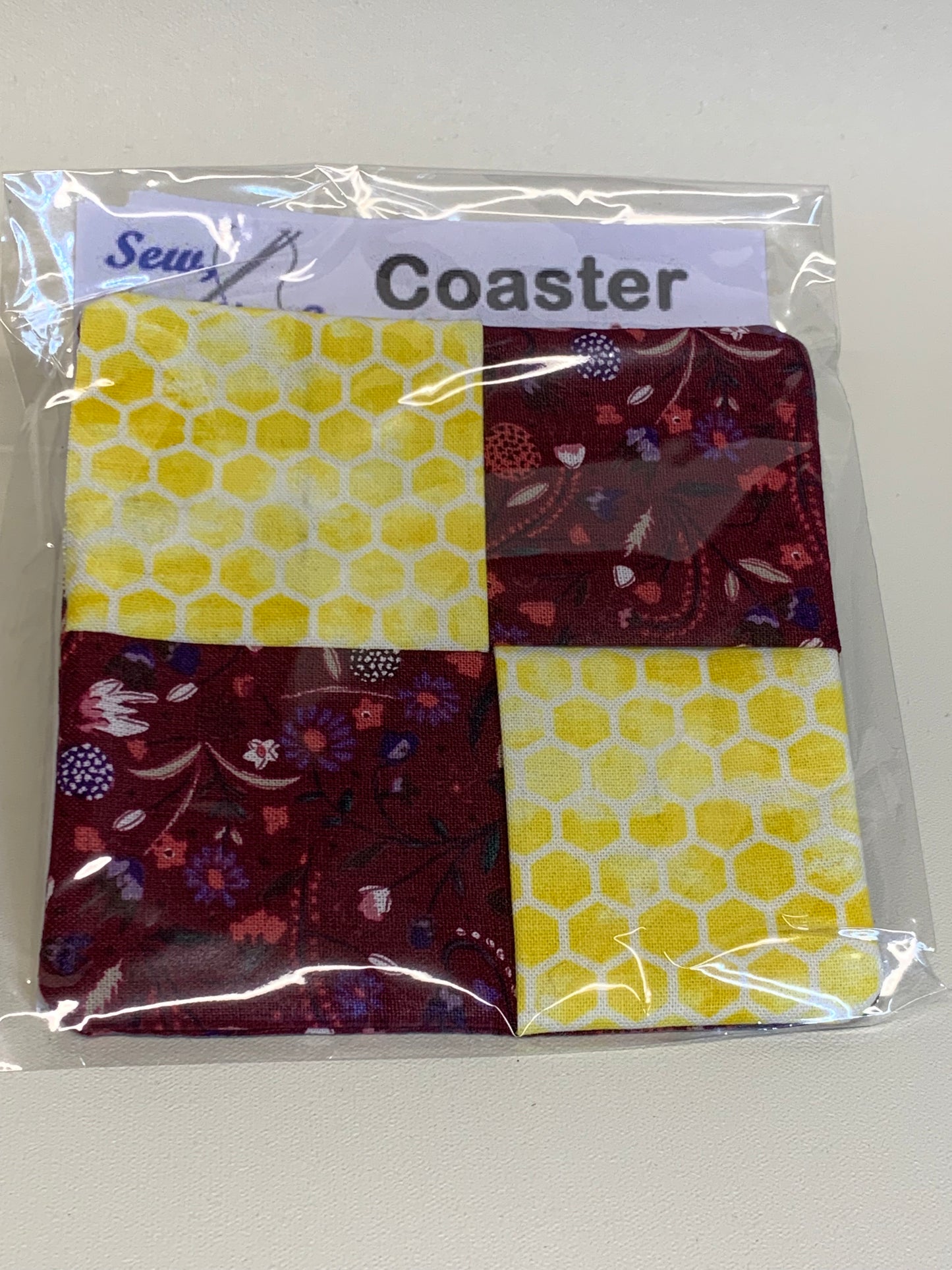 Coaster - Maroon with flowers and Yellow honeycombs