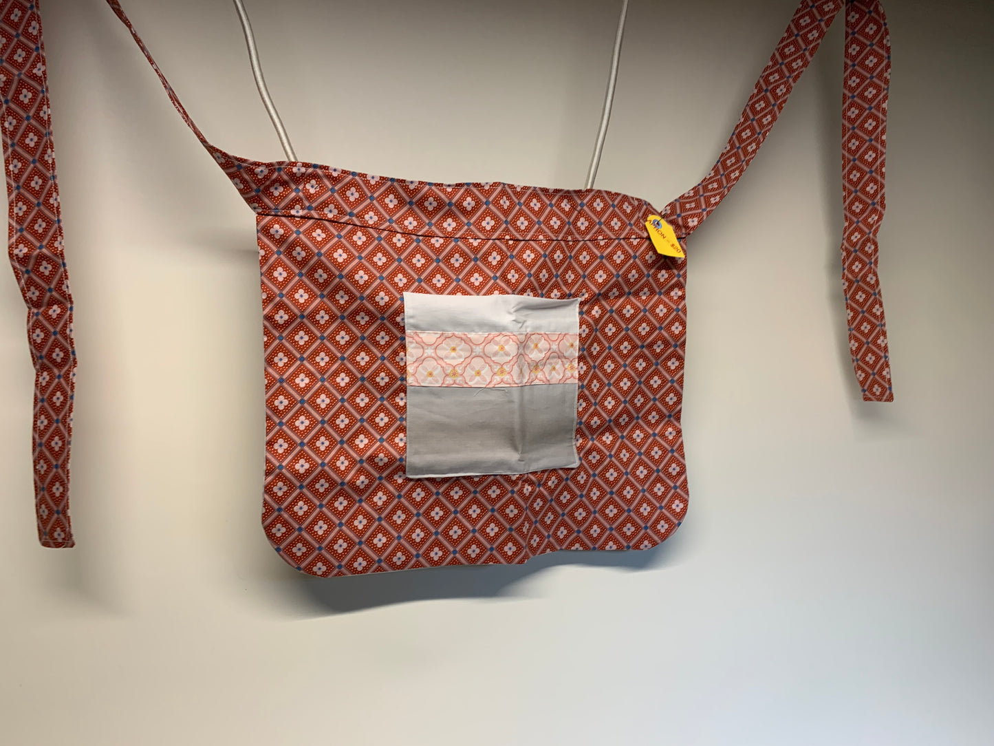Half Apron - reversable. Light red and grey with pink accents