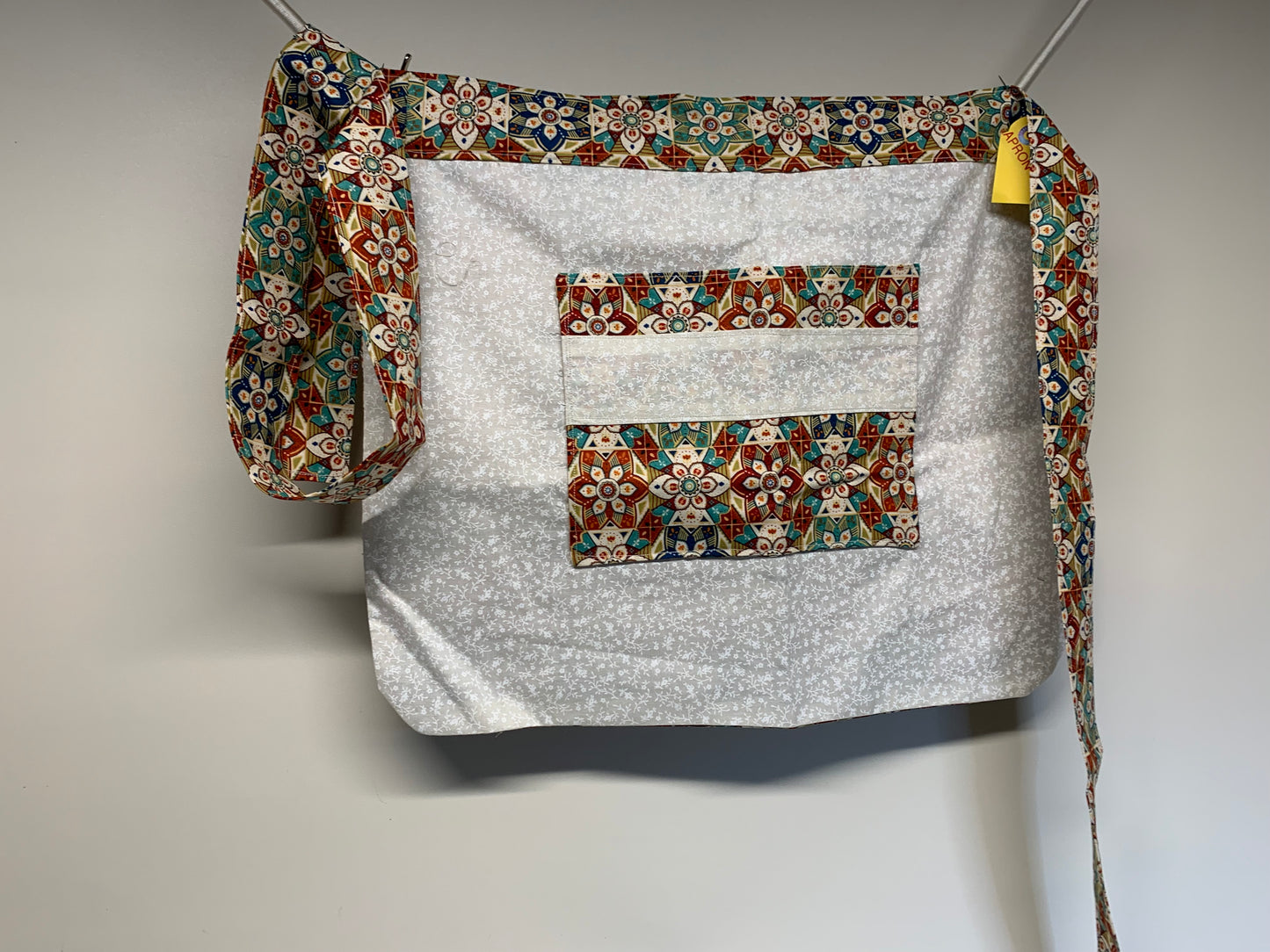 Half Apron - reversable. Multicolor geometrics and off white with white flowers