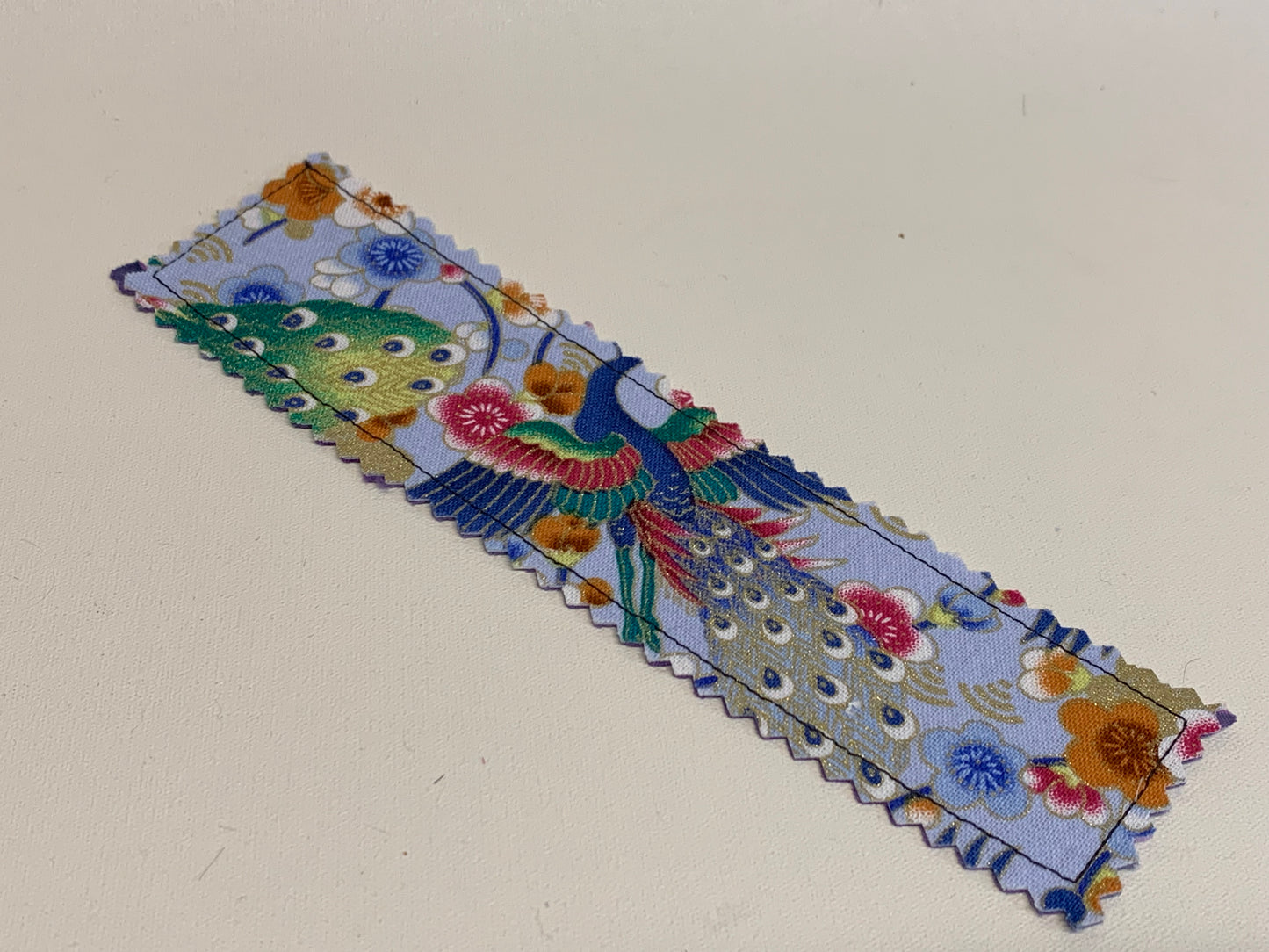 Traditional Bookmark -Light blue with peacocks