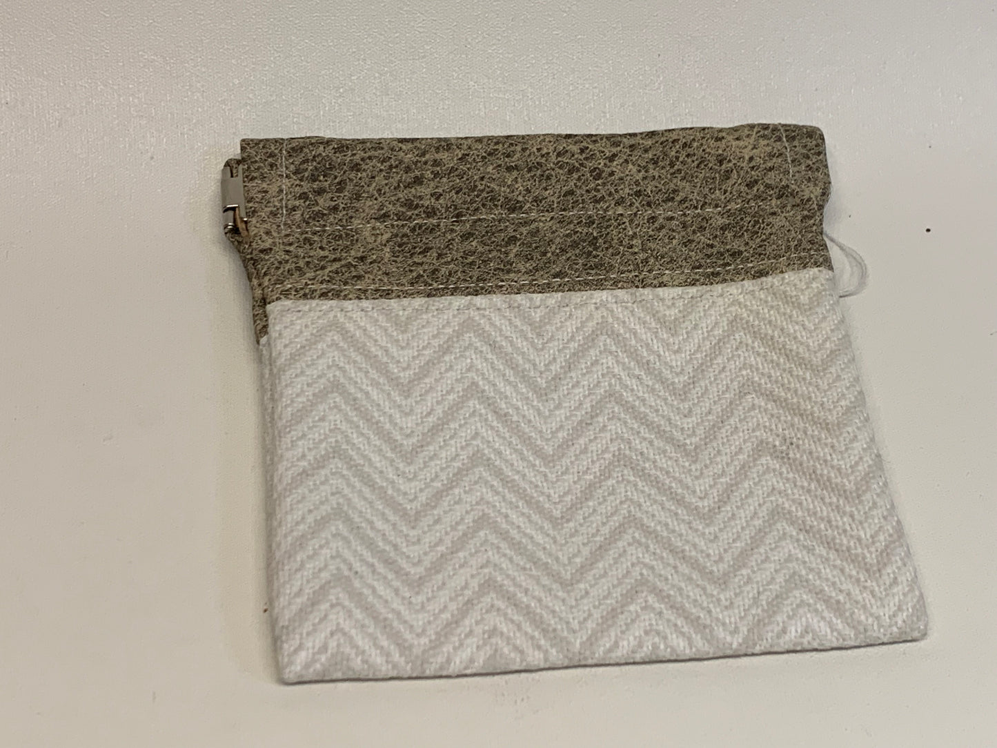 Unlined Pouch with Flex Frame Closure - Tan vinyl top and white/gray geometric fabric bottom- 4" x 4.5."