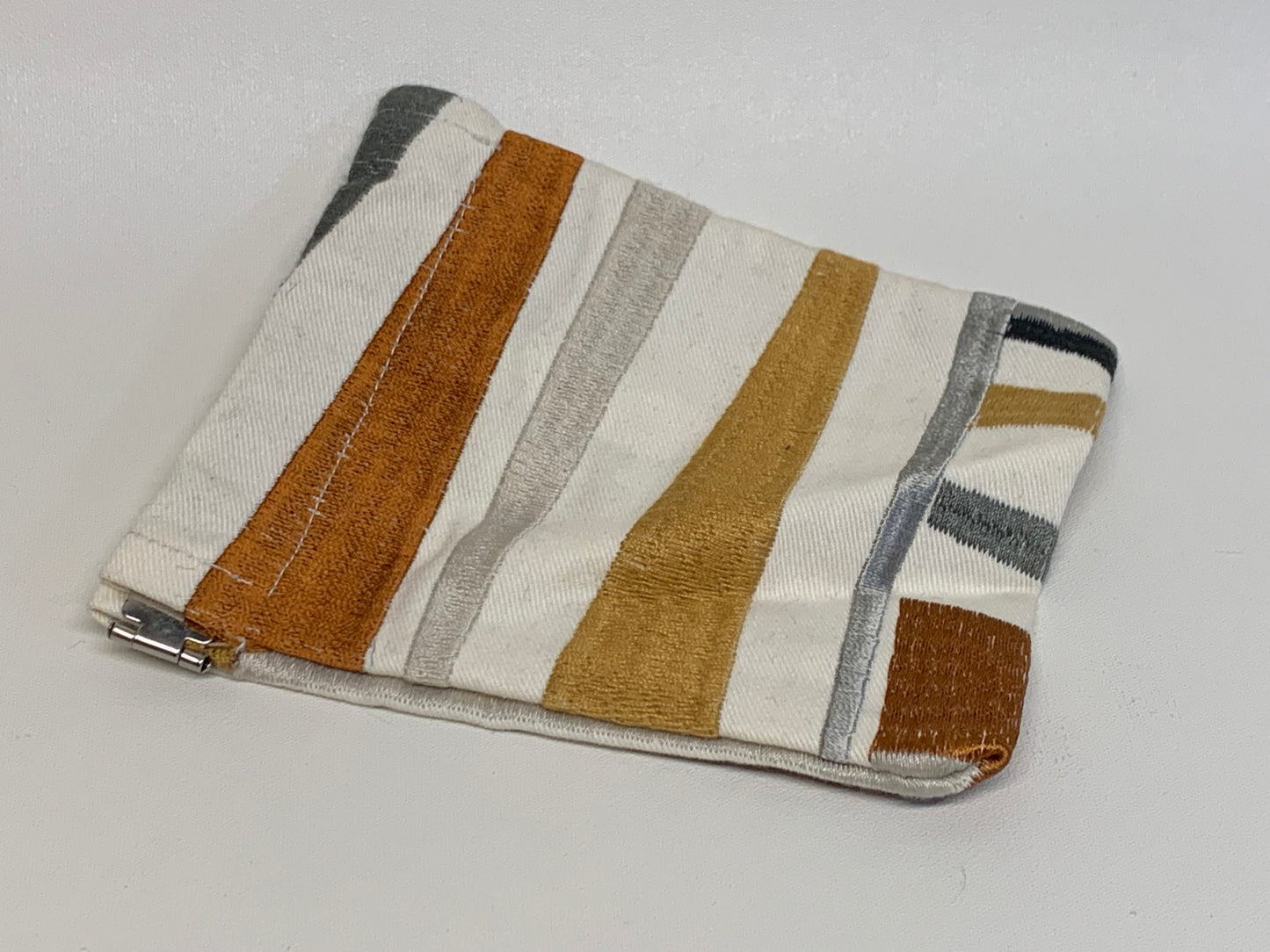 Unlined Pouch with Flex Frame Closure - White with black, tan and grey geometric fabric - 4.5" x 5.25"