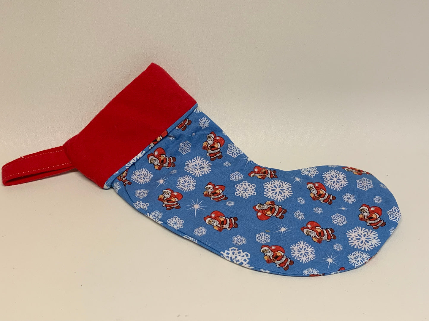 Small Christmas Stocking - Light blue with snowflakes and Santas- approx. 11" tall x 4.25" wide.