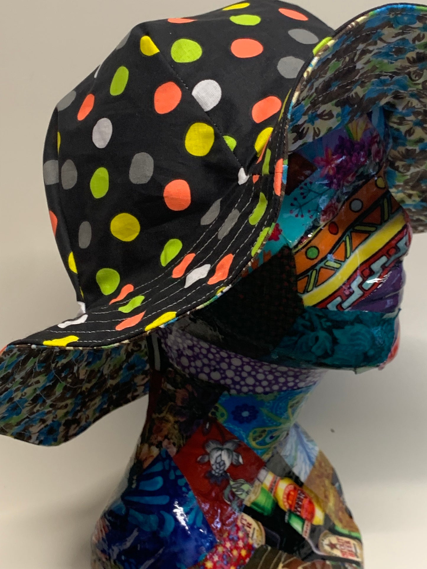 Bucket Hat - Reversable Designs - blue and brown flowers on side one - Black with colored dots on the reverse