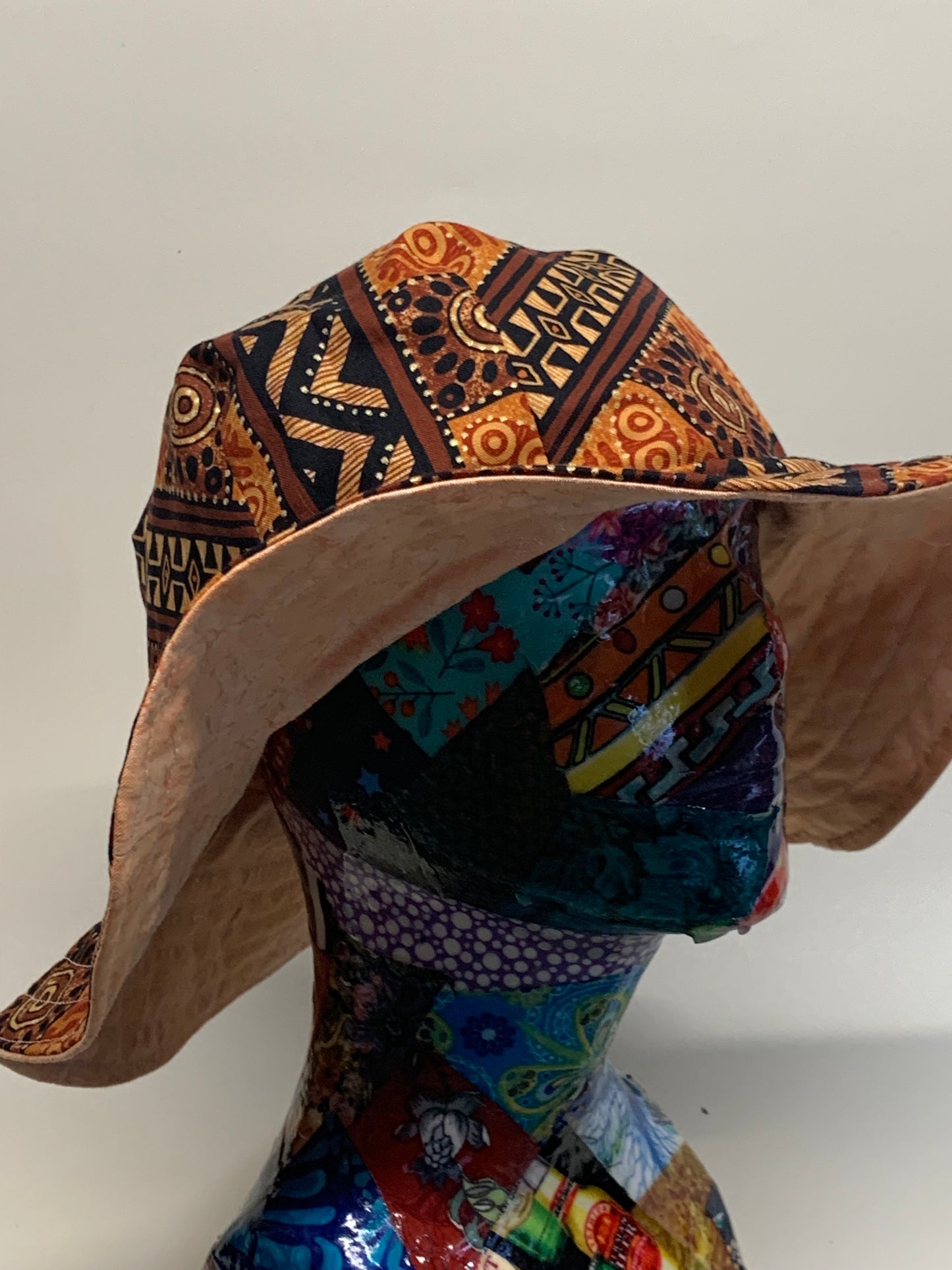 Bucket Hat - Reversable Designs - Brown geometric on side one - Peach colored on the reverse