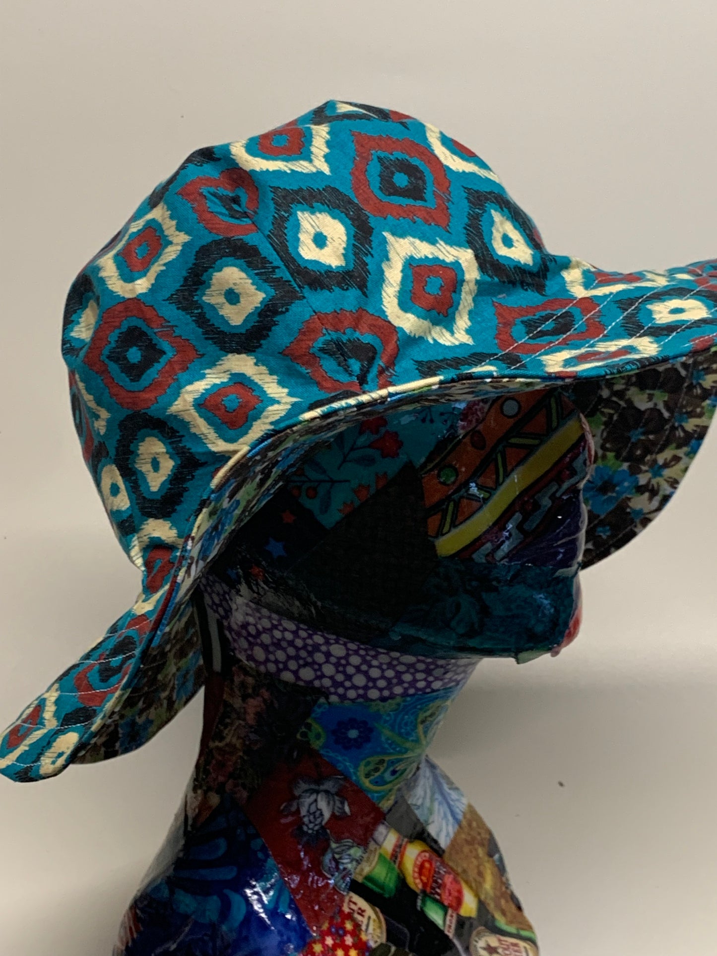 Bucket Hat - Reversable Designs - Blue with geometric dots on side one - Blue and blown flowers on the reverse.