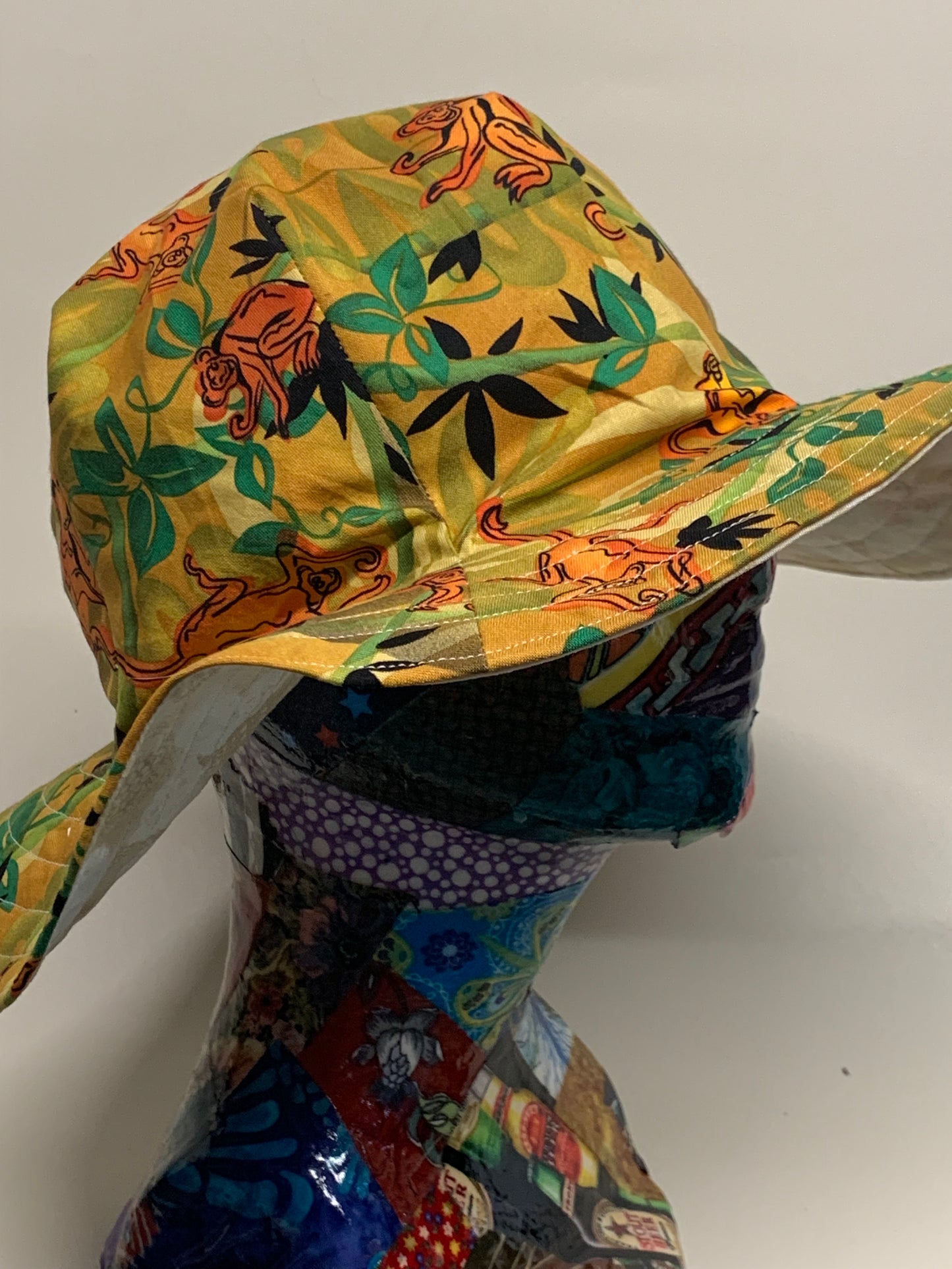 Bucket Hat - Reversable Designs - Tan on side one - Tan with monkeys on the reverse.
