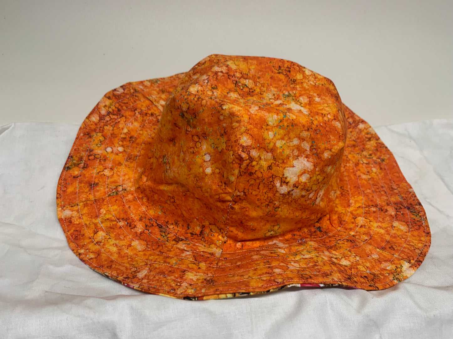 Bucket Hat - Reversable Designs - Chickens on side one - Orange on the reverse.