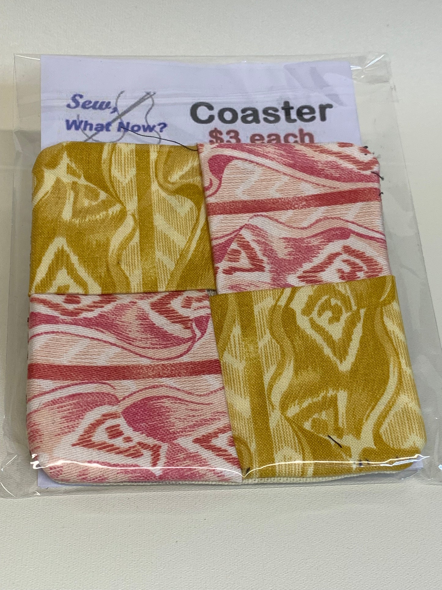 Coaster - tan and pink wood grain