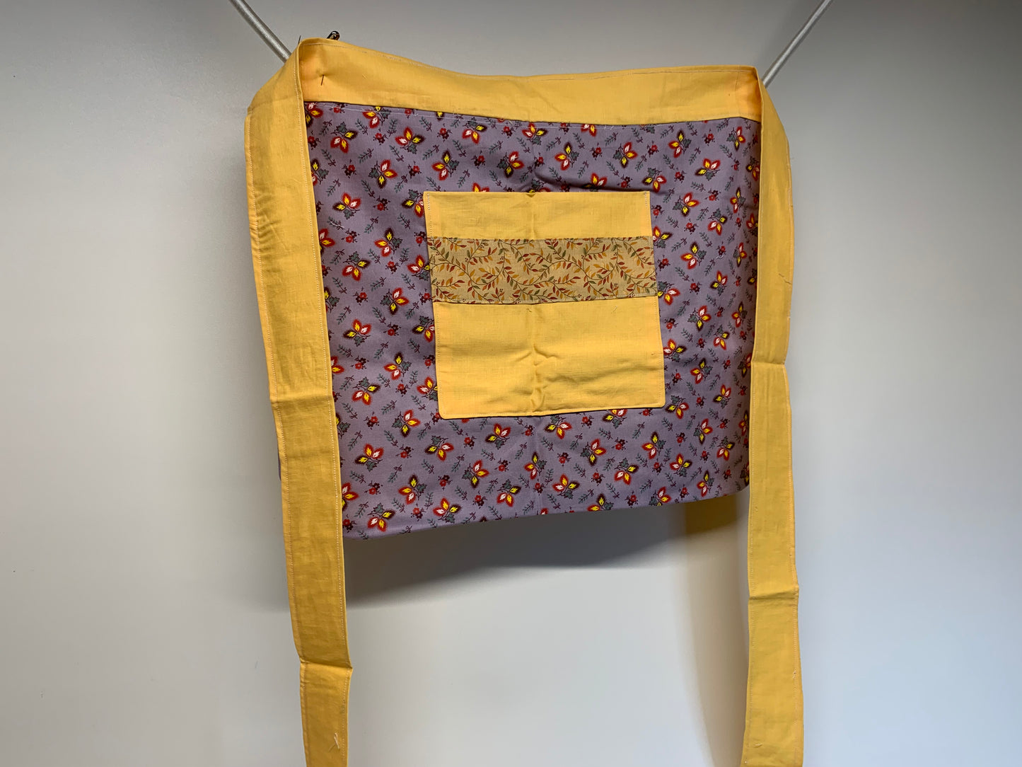 Half Apron - reversable. Yellow and lavender with flowers.