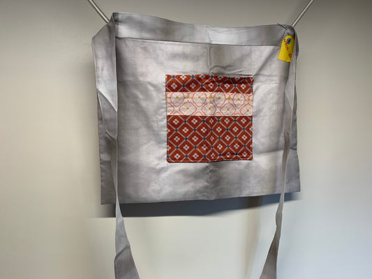 Half Apron - reversable. Light red and grey with pink accents