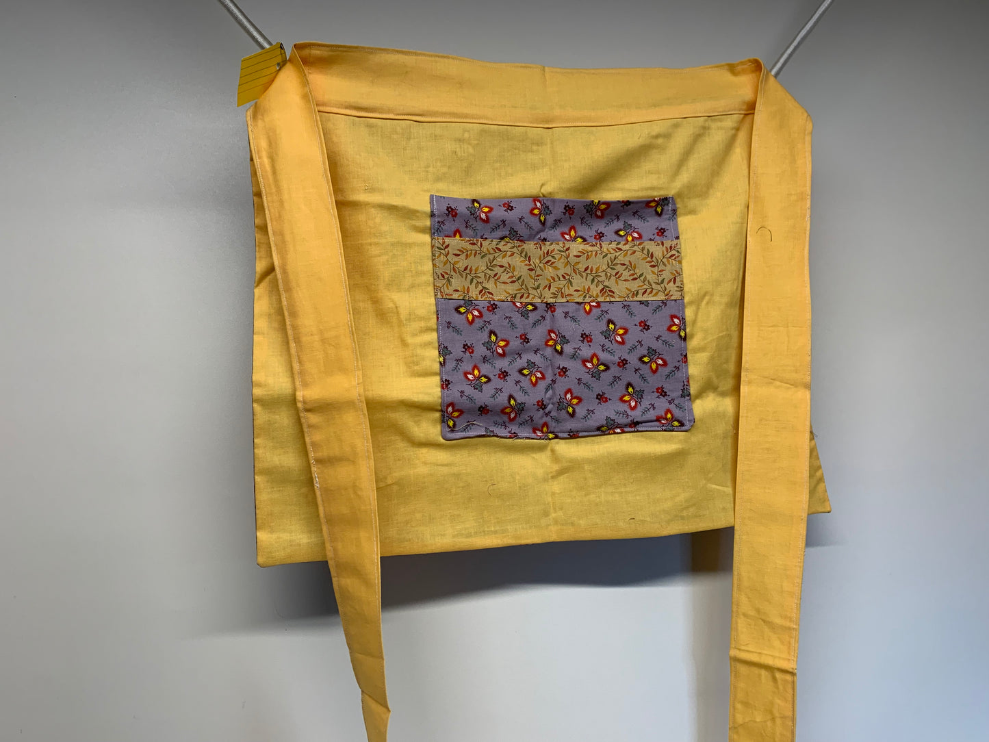 Half Apron - reversable. Yellow and lavender with flowers.