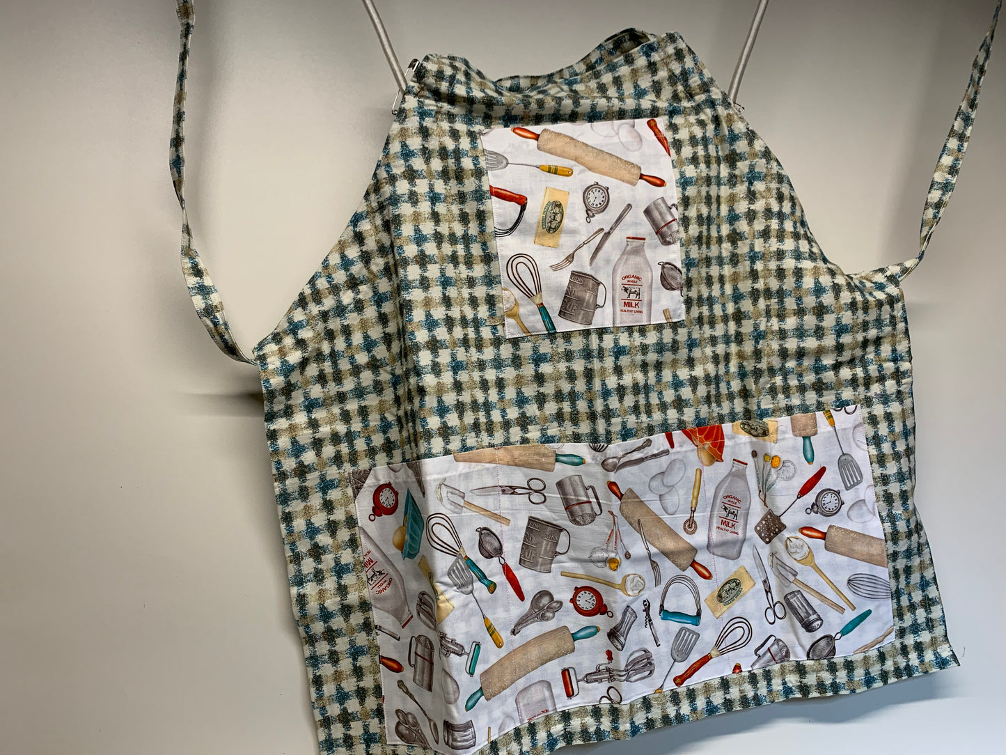 Full size Apron -Adjustable neckline. Tan/Gold/blue plaid with kitchen utensils