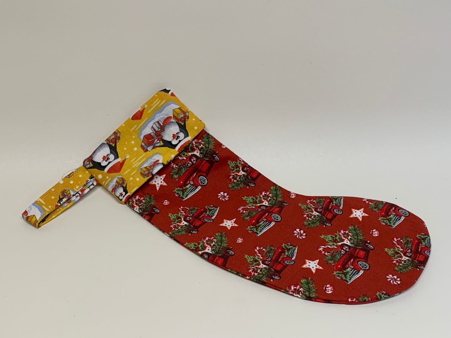 Small Christmas Stocking - Red with classic truck and yellow- approx. 11" tall x 4.25" wide.