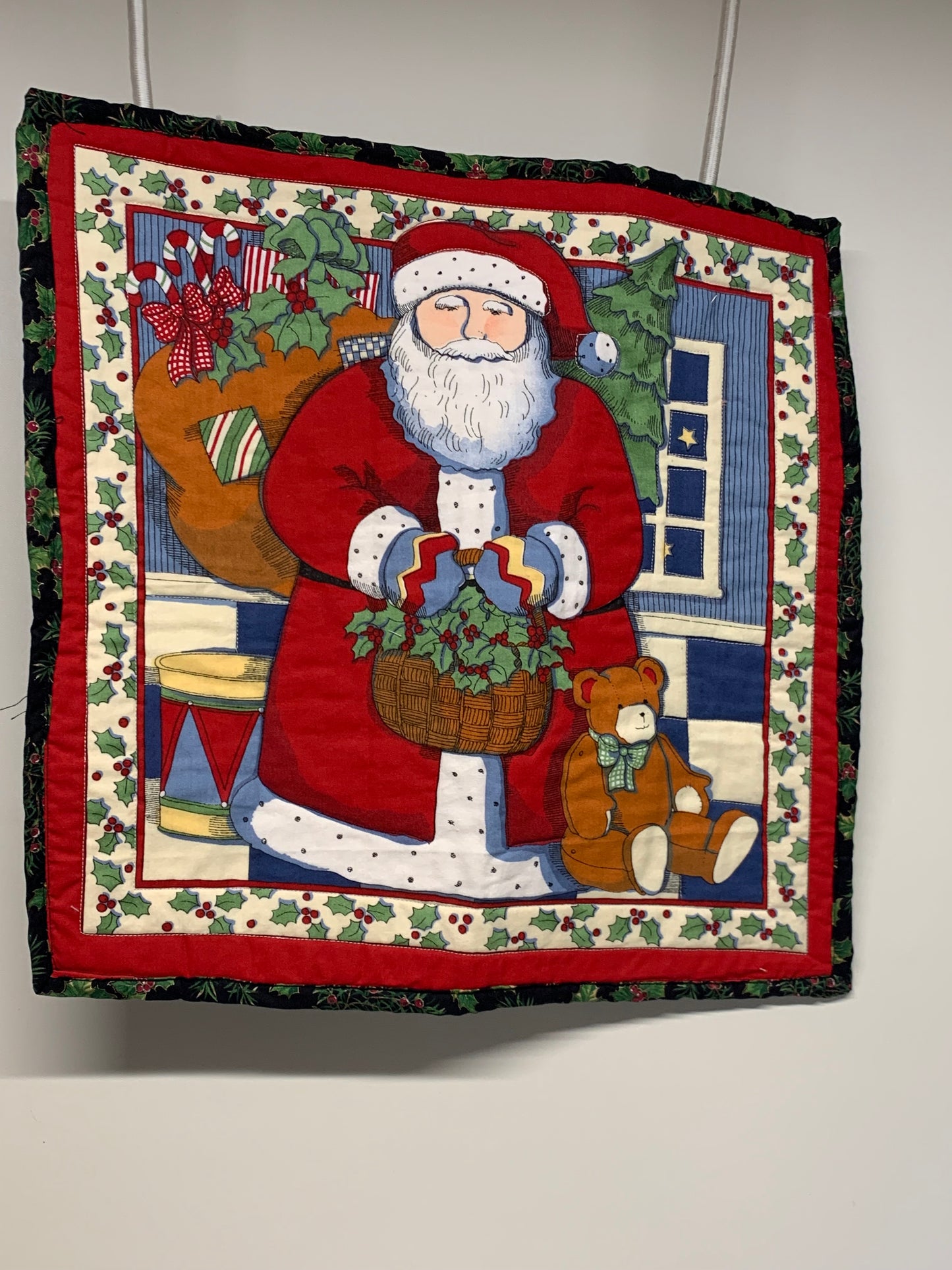 Wall Hanging - Santa with basket of holly.   17.5" x 17.5"