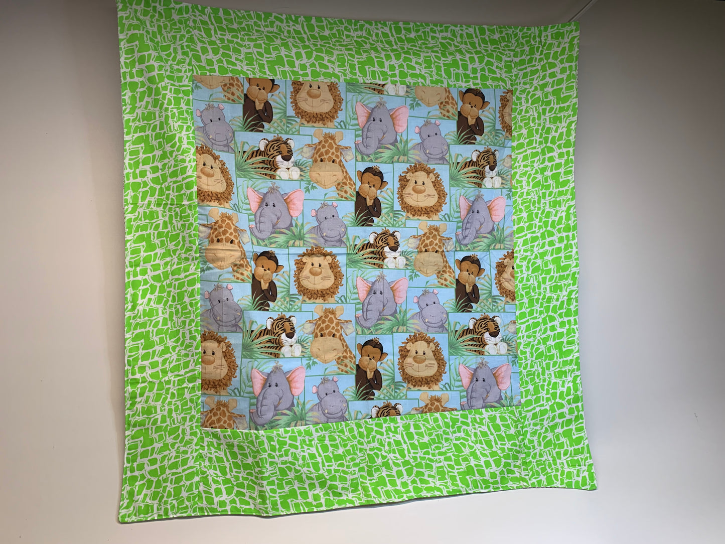 Baby Blanket - Side 1: Animals  - Side 2: white/tan flannel plaid