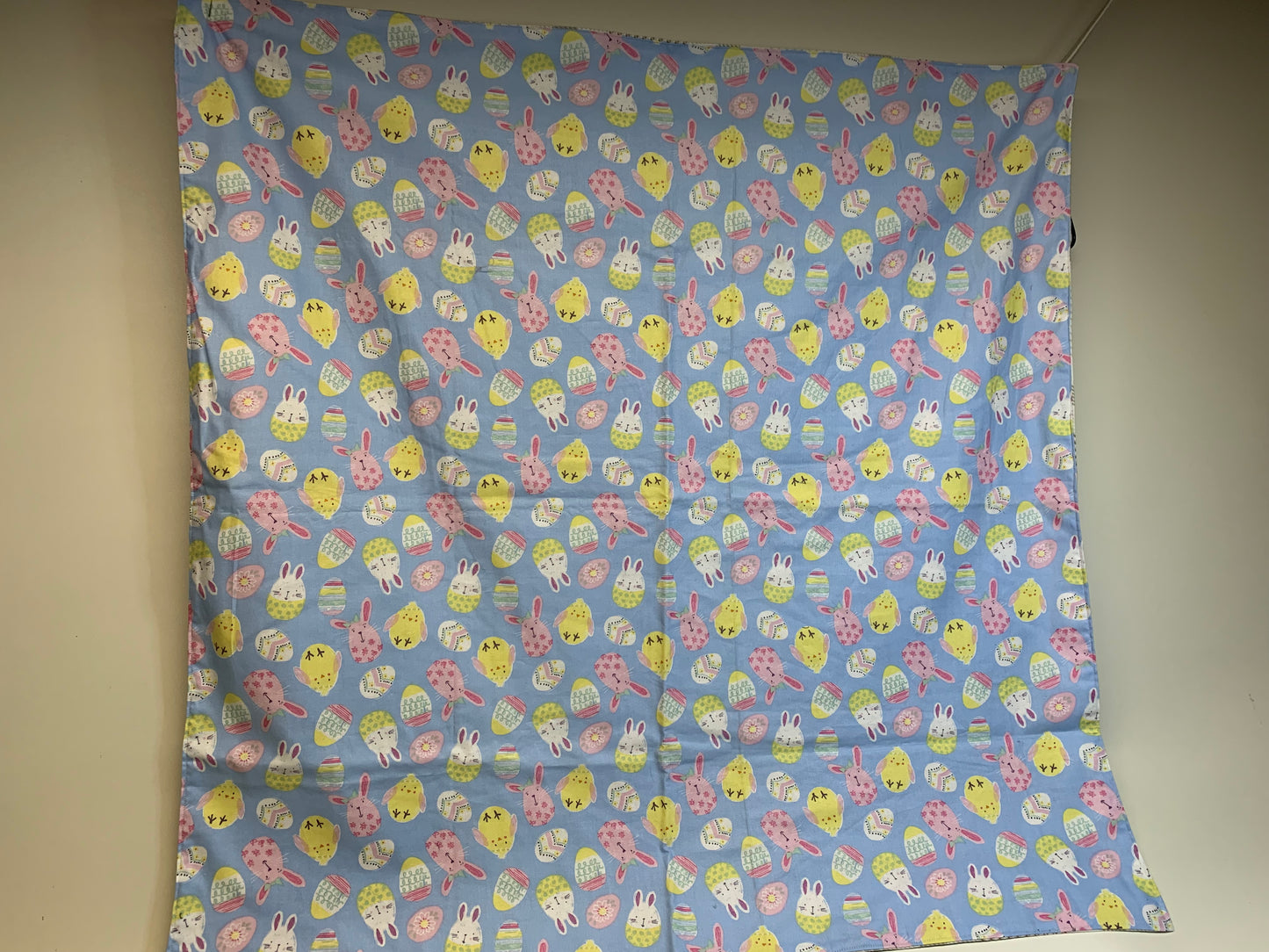 Baby Blanket - Side 1: light blue with Easter eggs, chicks and bunnies  - Side 2: white and tan flannel plaid
