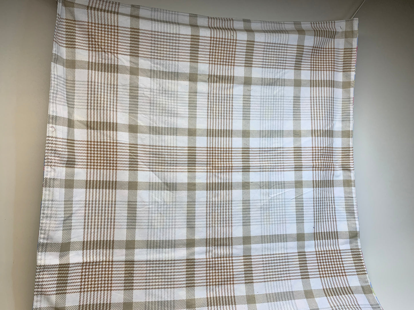 Baby Blanket - Side 1: light blue with Easter eggs, chicks and bunnies  - Side 2: white and tan flannel plaid