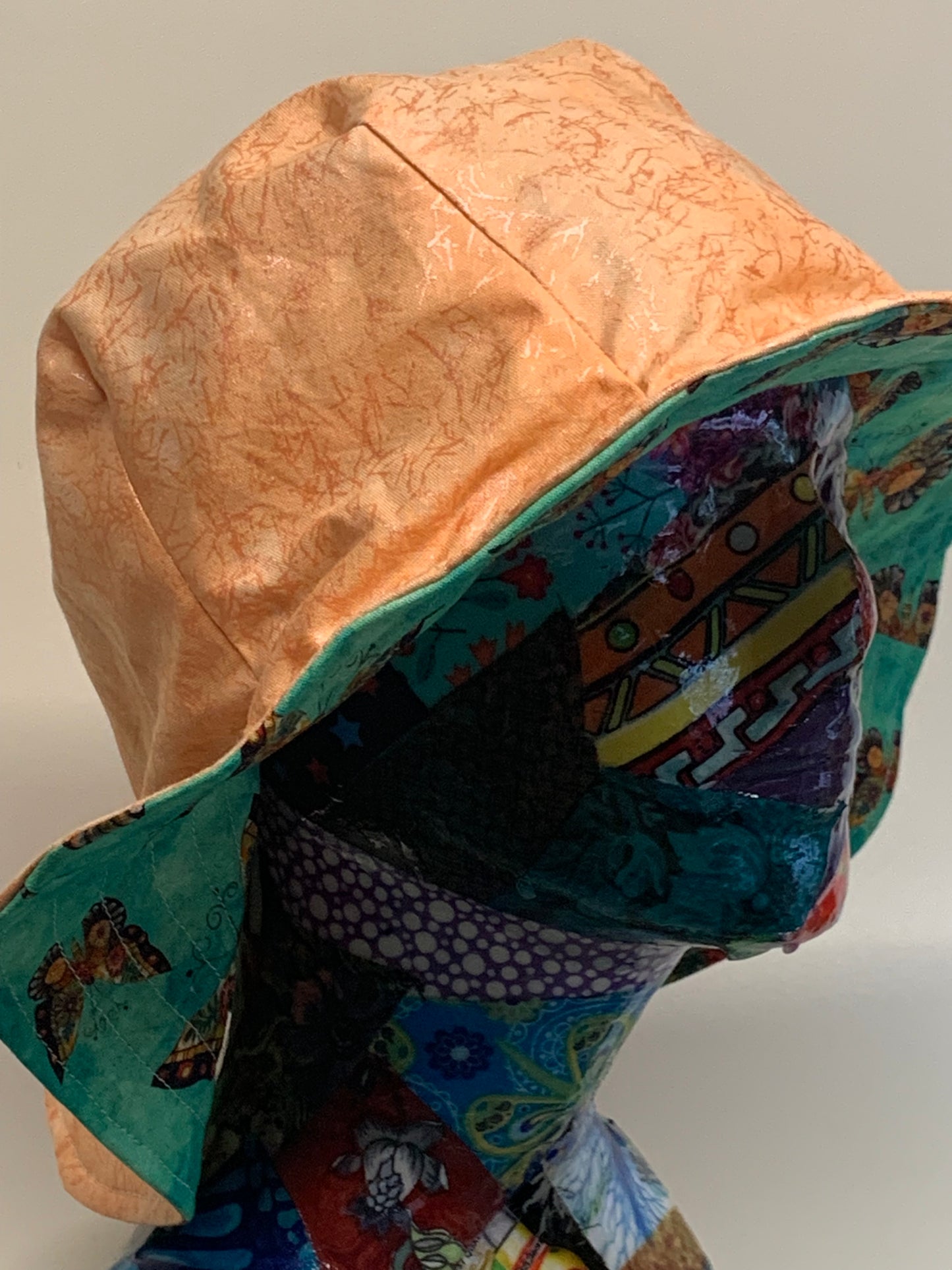Bucket Hat  - Reversable Designs - Peach color on side one - Teal with butterflies on the reverse