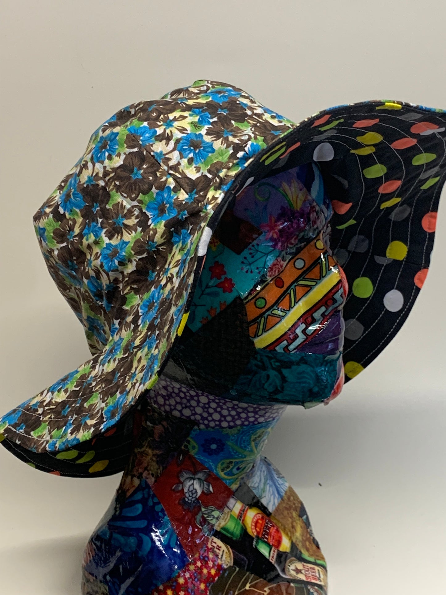 Bucket Hat  - Reversable Designs - blue and brown flowers on side one - Black with colored dots on the reverse