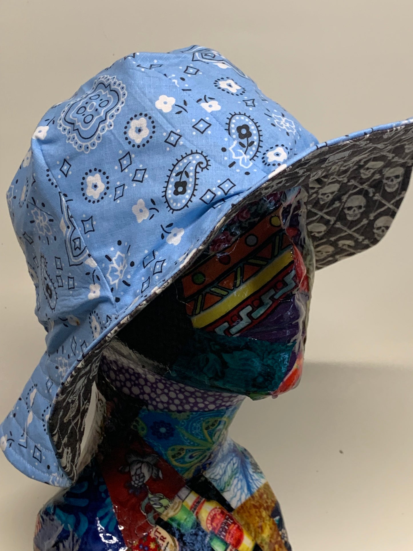 Bucket Hat  - Reversable Designs - Blue Paisley on side one - Grey and white skull and crossbones on the reverse.