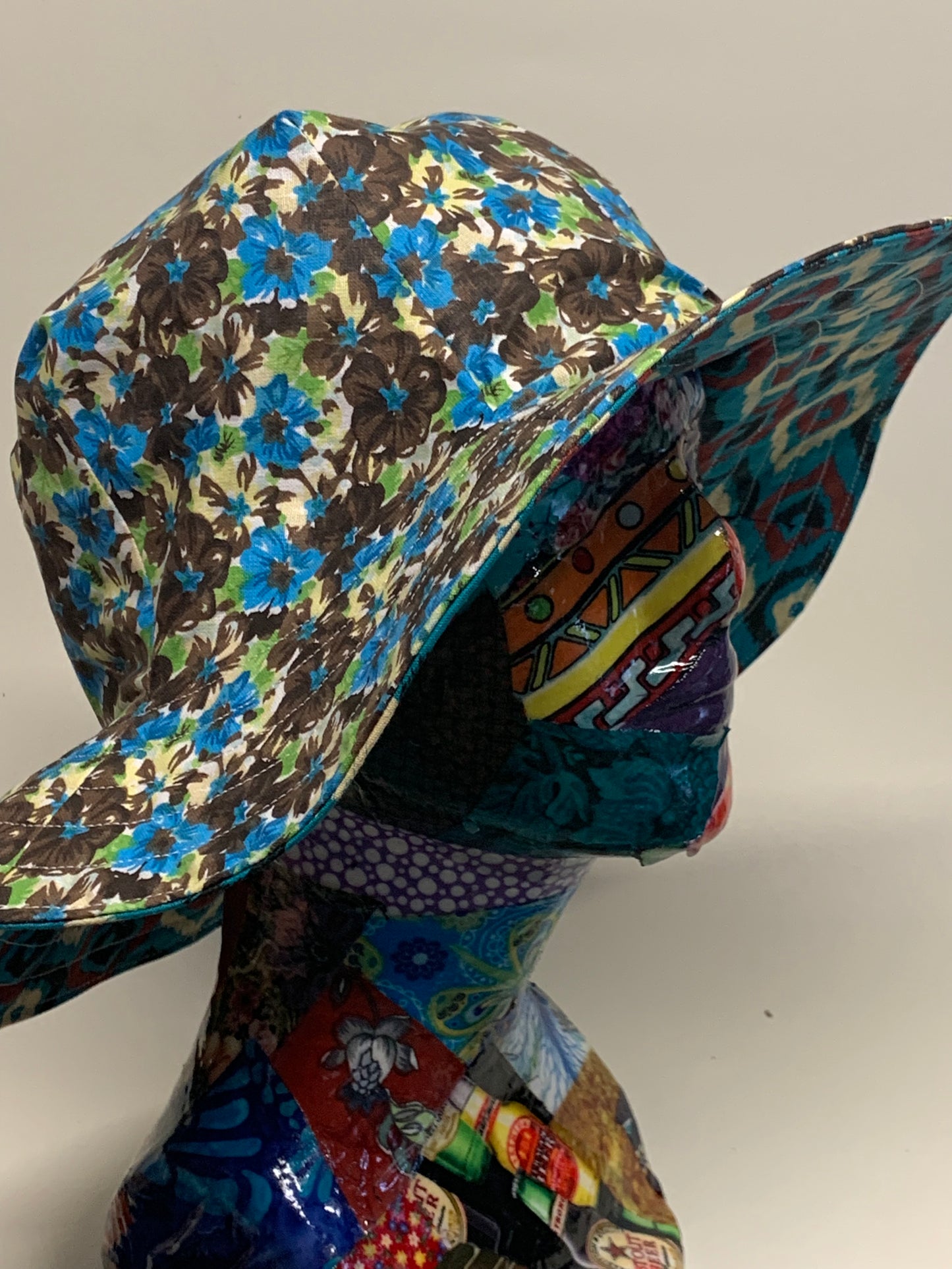 Bucket Hat  - Reversable Designs - Blue with geometric dots on side one - Blue and blown flowers on the reverse.