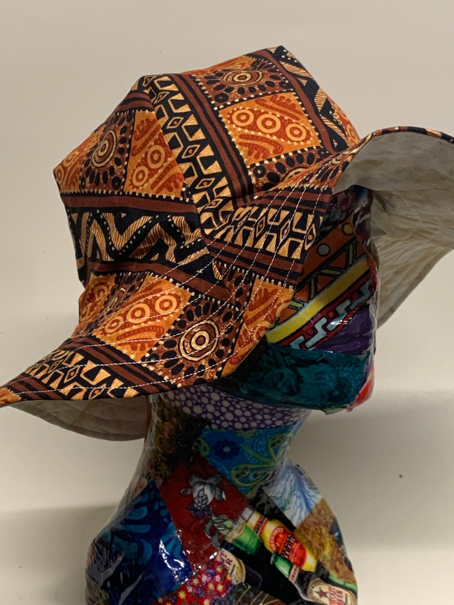 Bucket Hat  - Reversable Designs - Tan on side one - Brown geometric on the reverse.