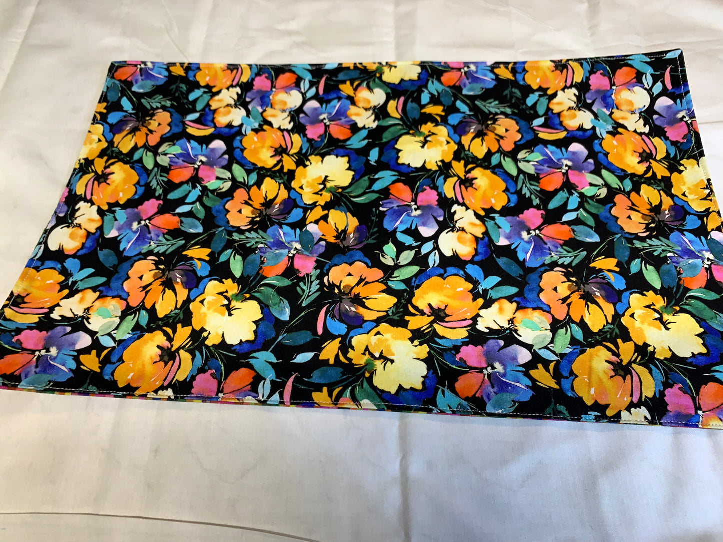 Placemat  - Floral on side one and multi color stripes on other side. - 11 1/2" x 17"