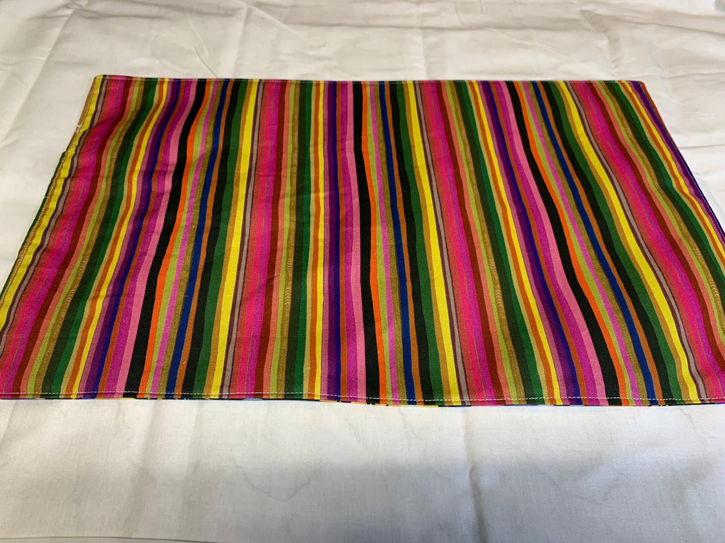 Placemat  - Floral on side one and multi color stripes on other side. - 11 1/2" x 17"