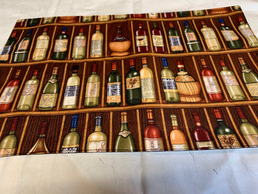 Placemat  - Wine bottles on one side and brown geometrics on the other side - 11 1/2" x 17"
