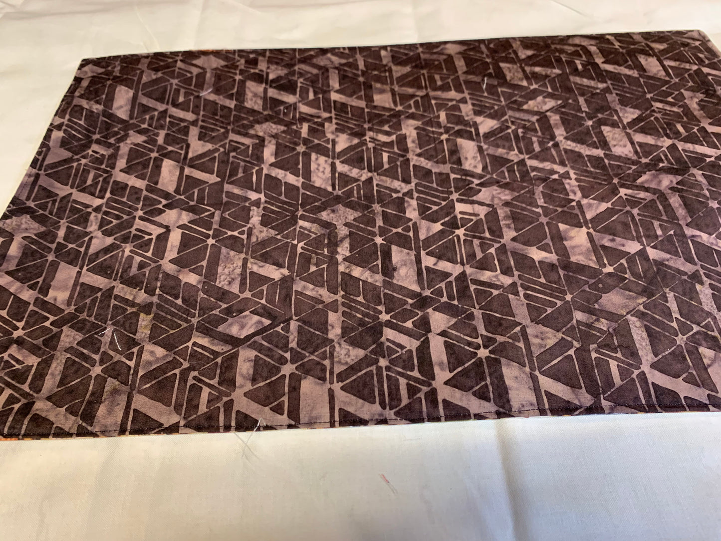 Placemat  - Wine bottles on one side and brown geometrics on the other side - 11 1/2" x 17"