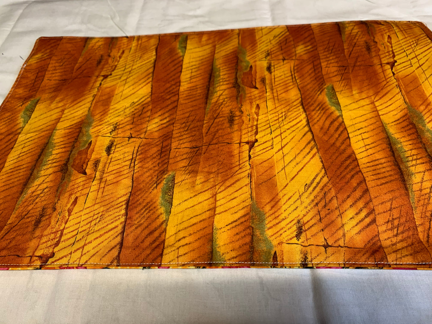 Placemat  - Chickens on one side and orange wood grain on the other side - 11 1/2" x 17"