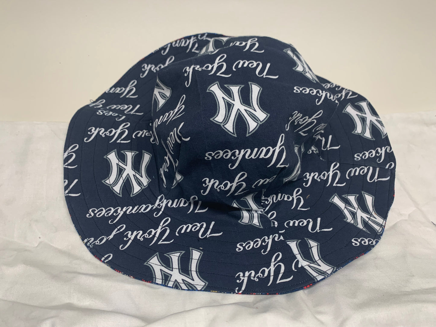 Bucket Hat  - Reversable Designs - NY Yankees on side one - Red, white and blue on the reverse.